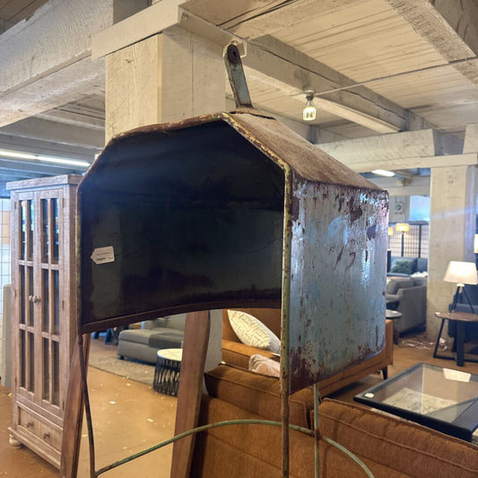 TV on a stand in a living room setting with furniture and decor.