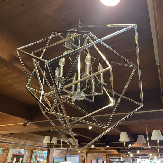 Chandelier with geometric design on a wooden ceiling