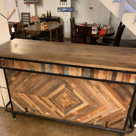 Wooden bar counter with a geometric pattern in a casual setting
