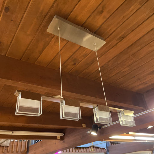 Modern pendant lights hanging from a wooden ceiling