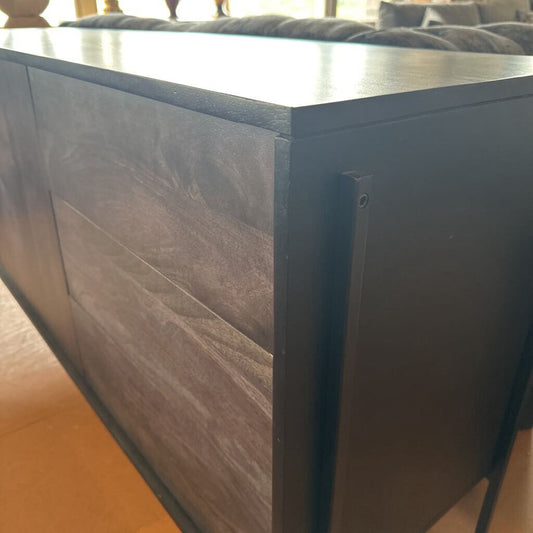 Close-up of a wooden cabinet with a blurred background