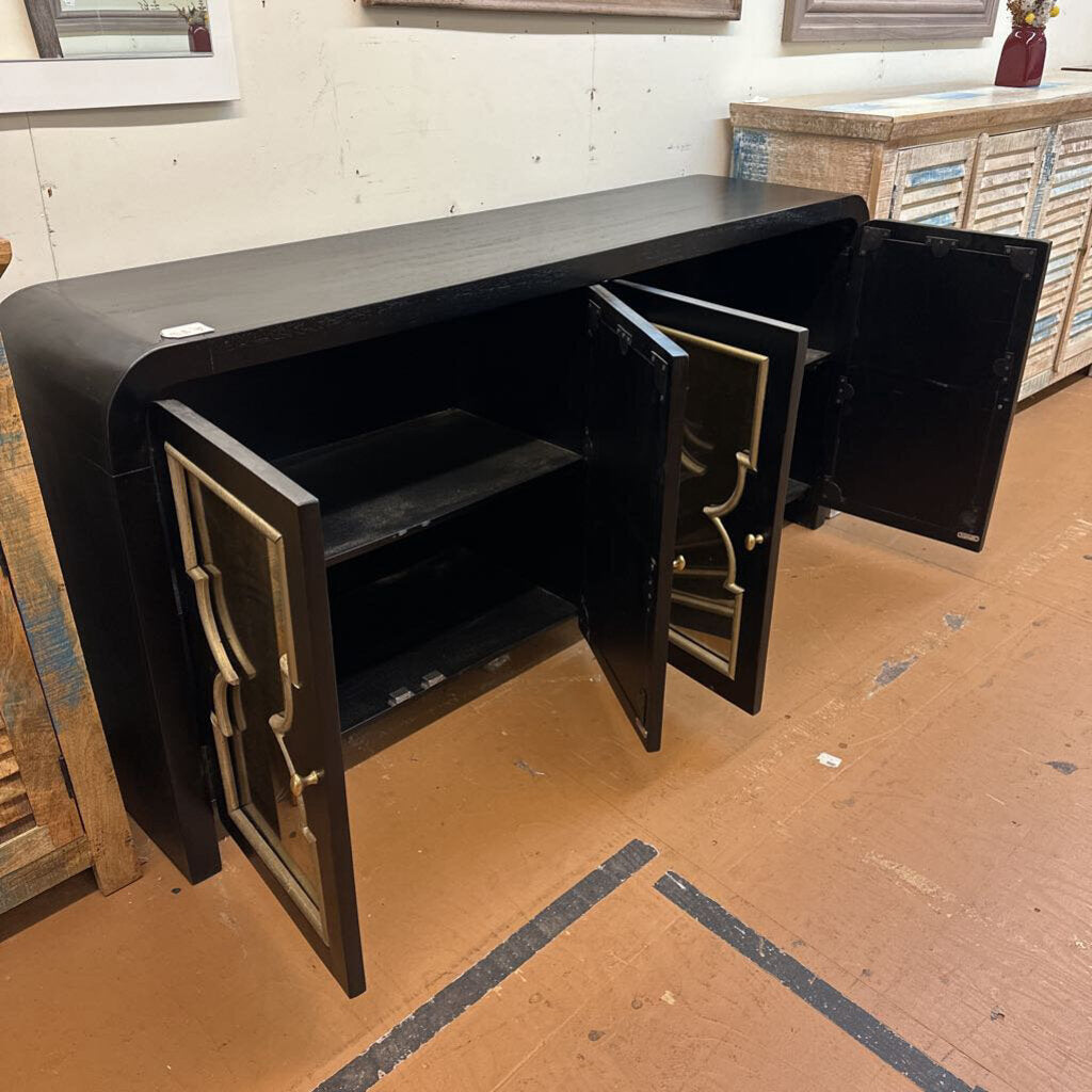 Black metal safe with open doors on a wooden floor