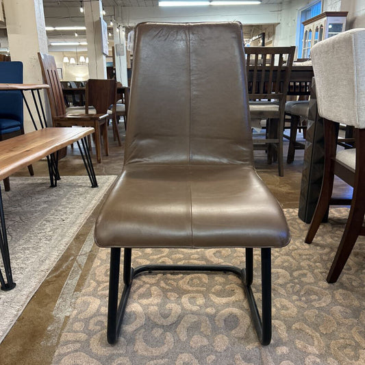 Brown leather chair in a furniture store setting