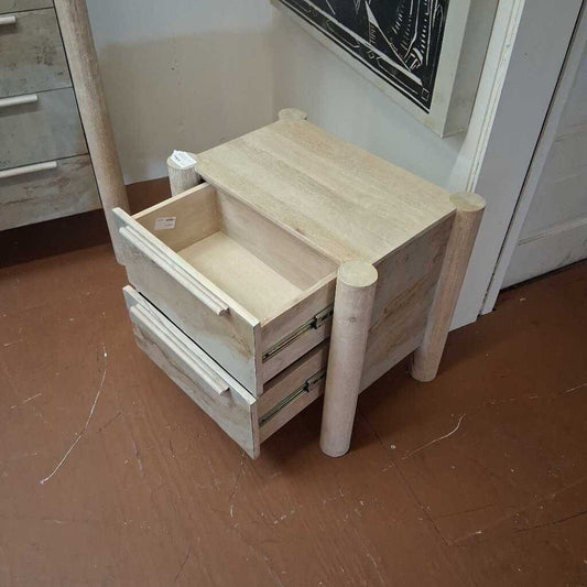 Wooden step stool with drawers on a wooden floor