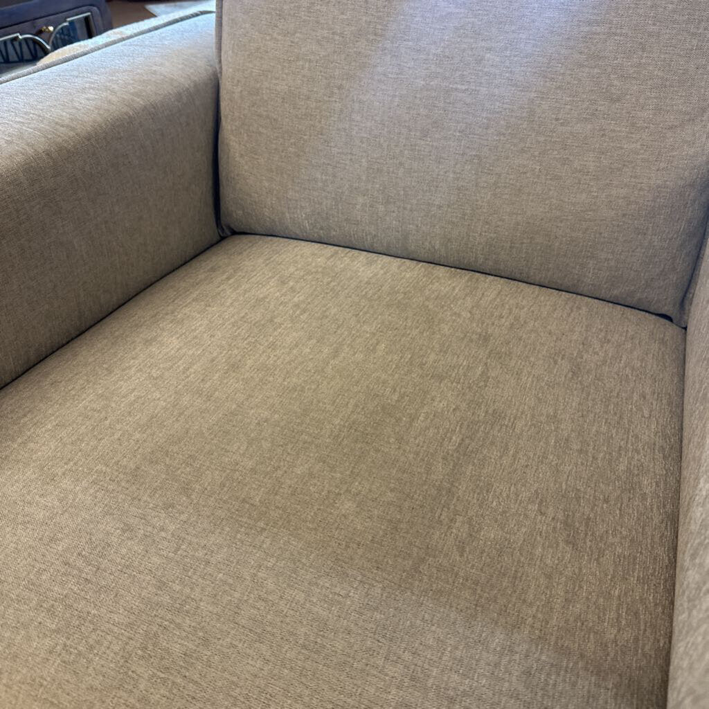 Gray fabric sofa with a focus on texture and color.