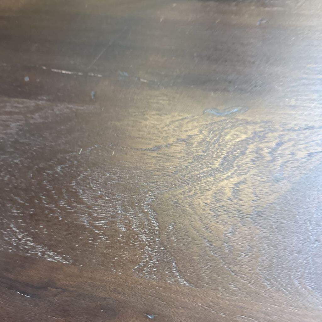 Close-up of a wooden surface with visible grain and texture