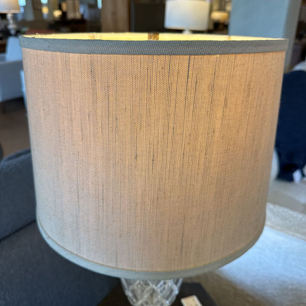 Textured beige lampshade in a room setting