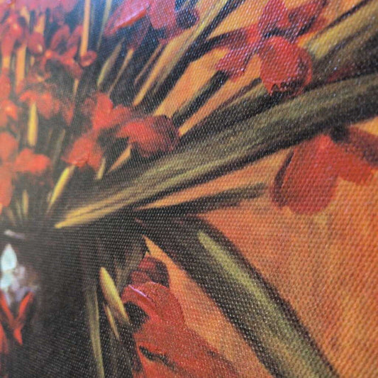 Close-up of a painting with red flowers and green leaves on an orange background