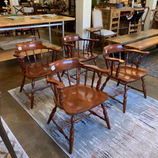 Set of wooden chairs in a furniture store setting