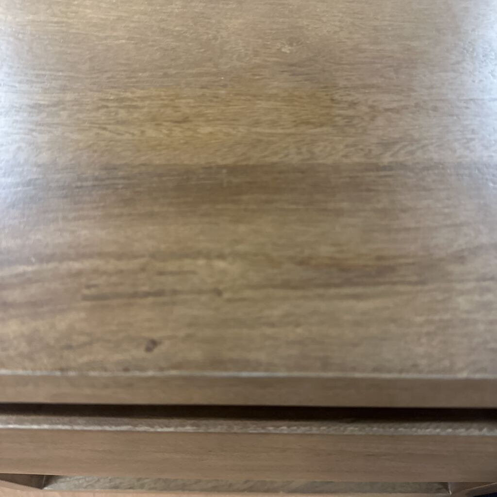 Close-up of a wooden surface with visible grain and texture