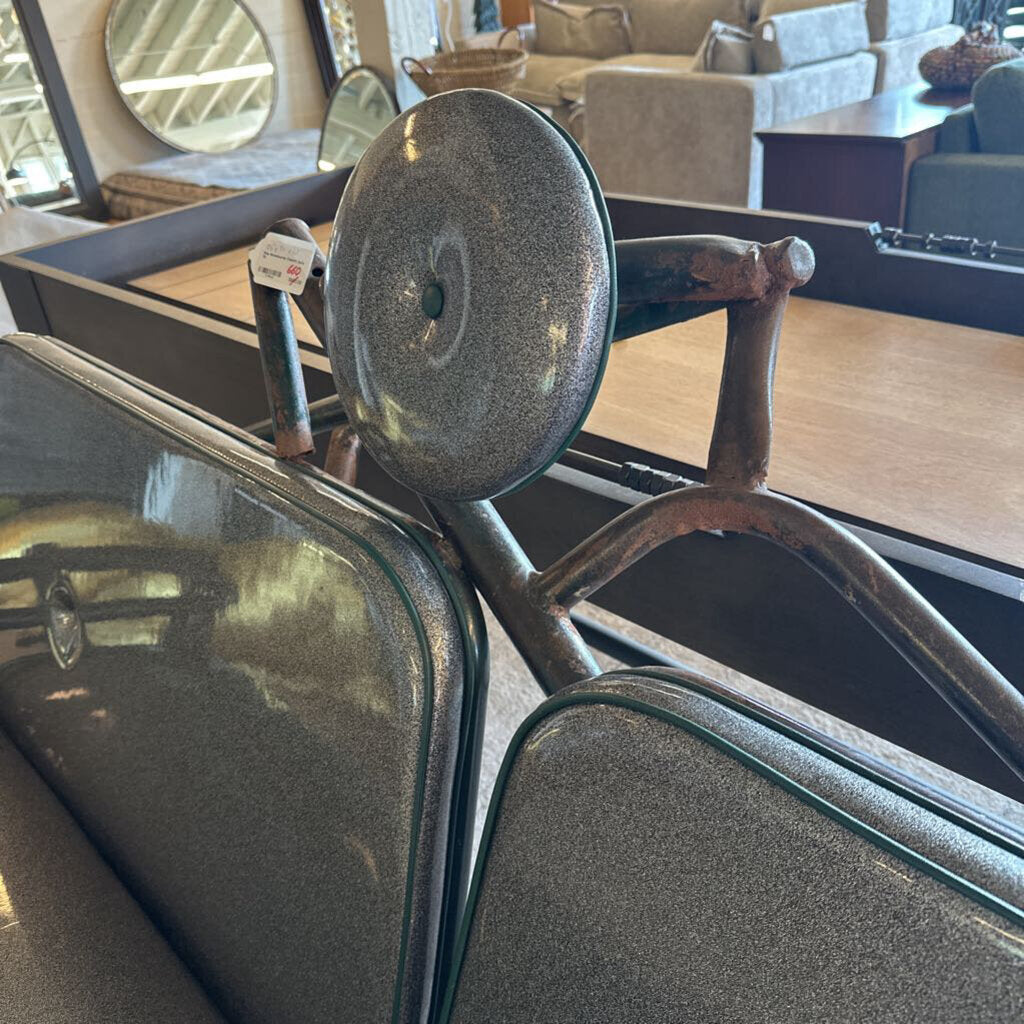 Close-up of a vintage car seat with a blurred interior background