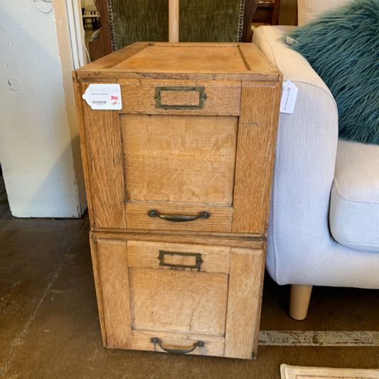 Wooden file cabinet with two drawers in a room setting