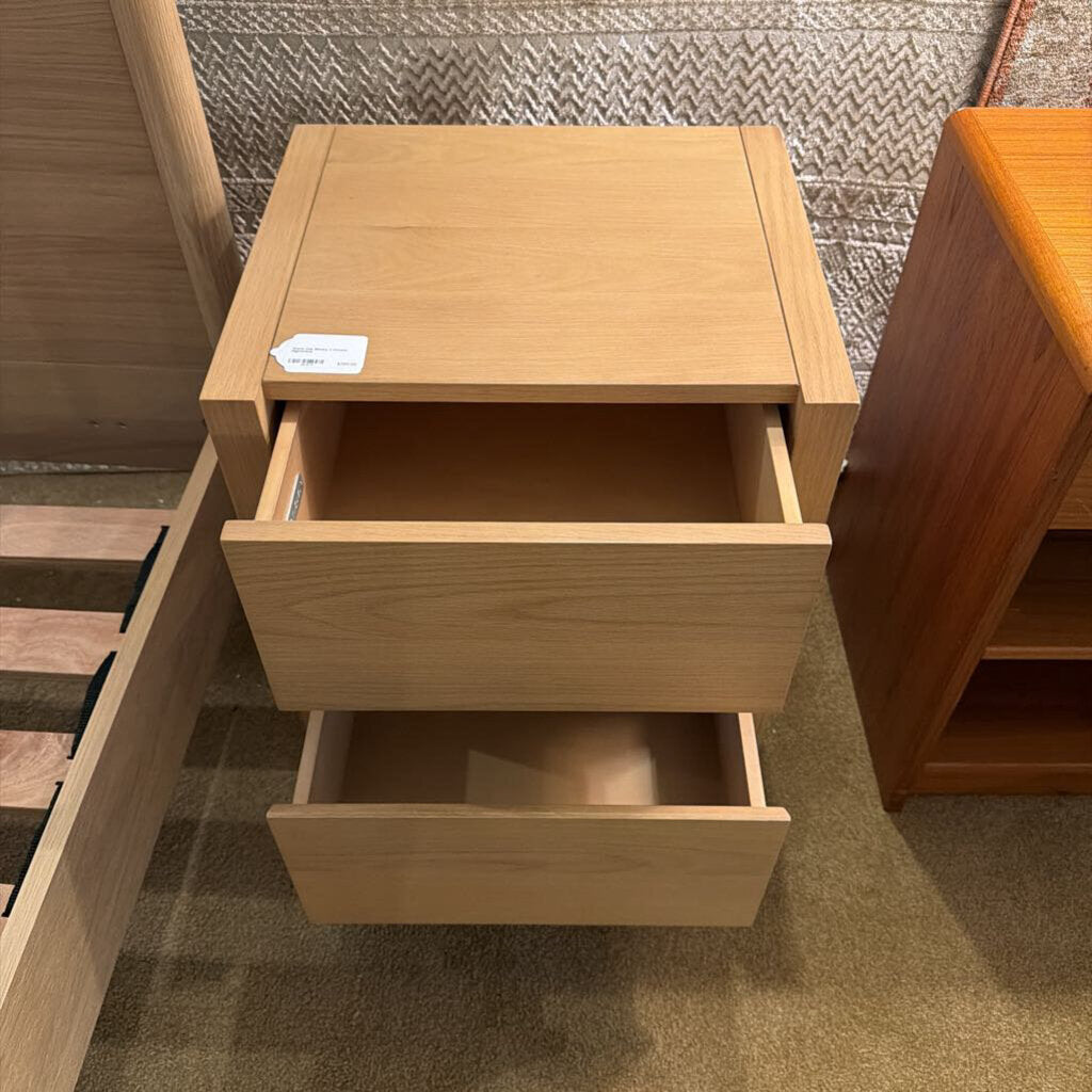 Wooden drawer unit with open drawers in a store setting