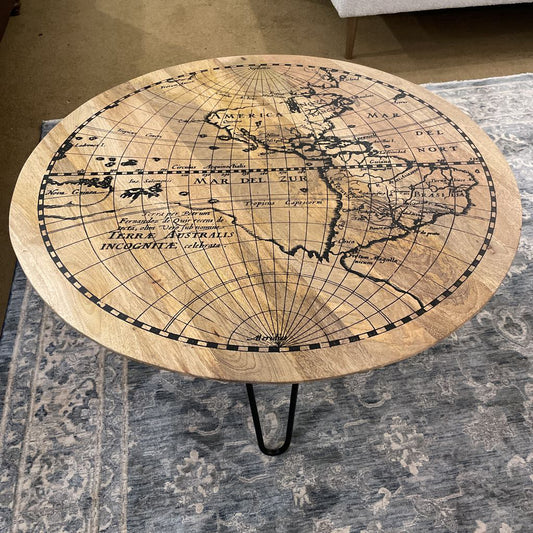 Round table with world map design on a patterned rug