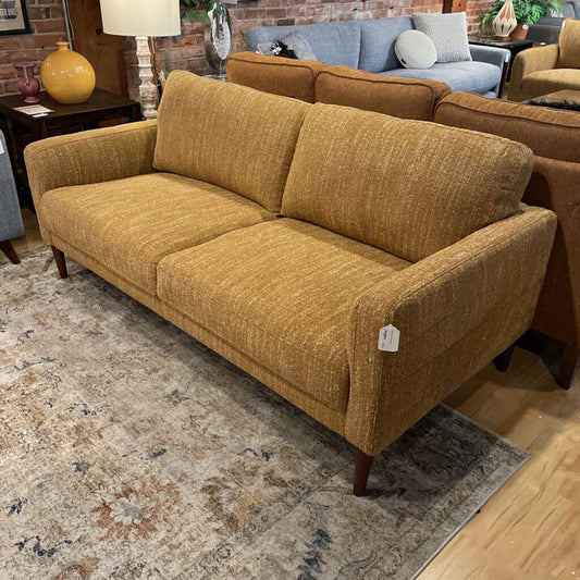 yellow sofa in showroom setting