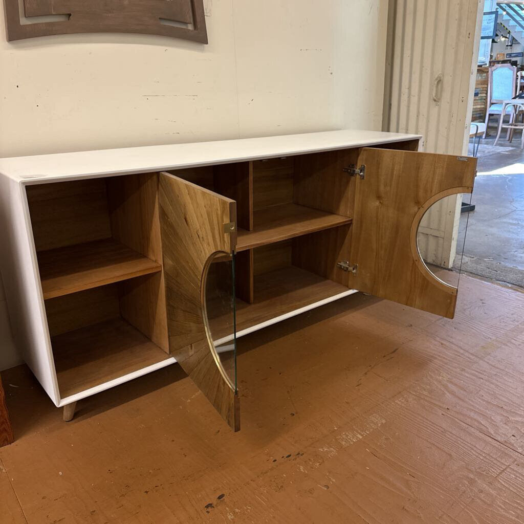 Wooden cabinet with open doors on a wooden floor