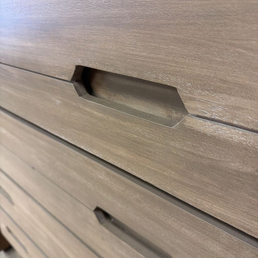 Close-up of a wooden drawer with a handle