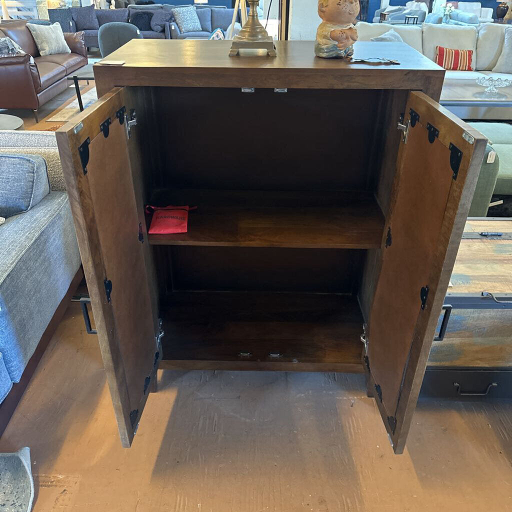 Wooden cabinet with open doors in a living room setting