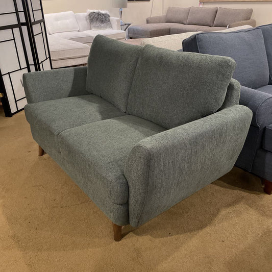 Gray sofa in a room with other furniture