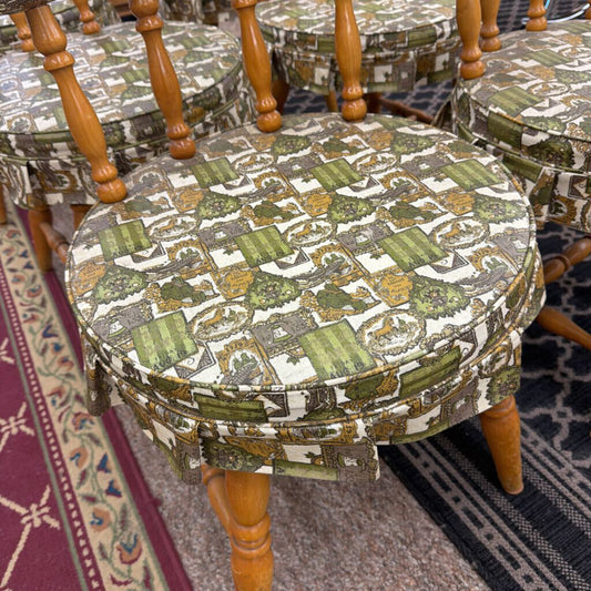 Round stools with patterned seats and wooden legs on a carpeted floor.