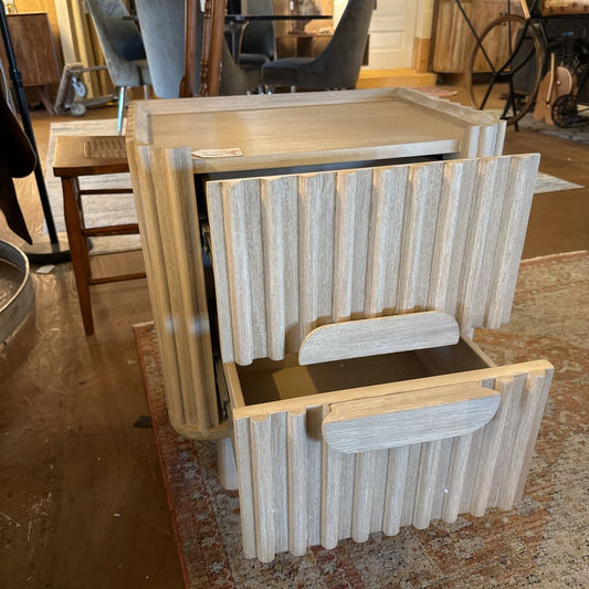 Wooden step stool with a textured design in a room setting