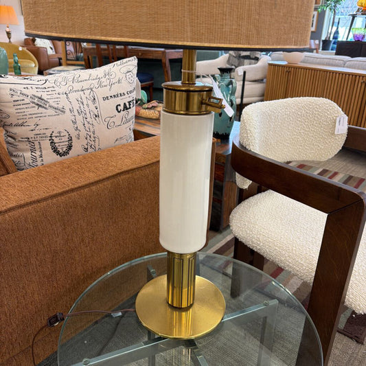 Decorative lamp on a glass table with a blurred indoor setting