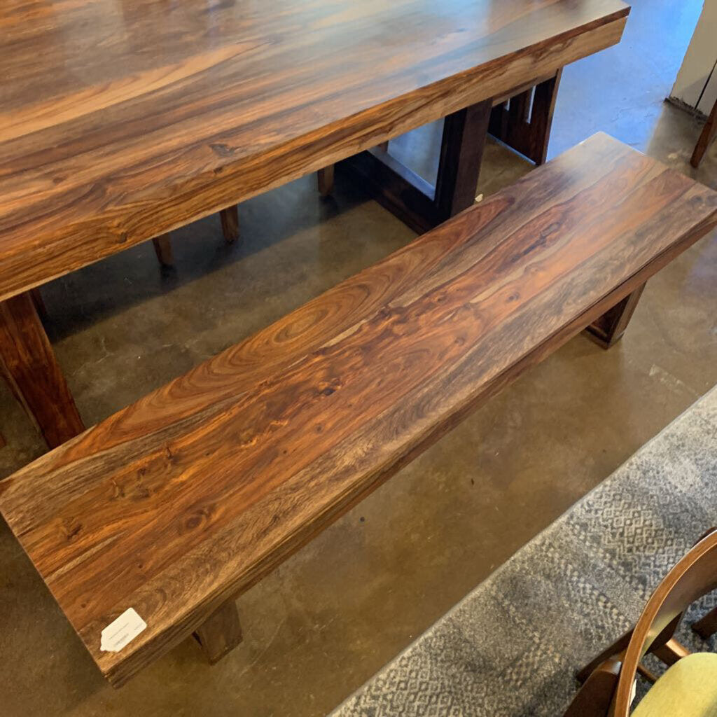 Wooden bench and table set on a concrete floor