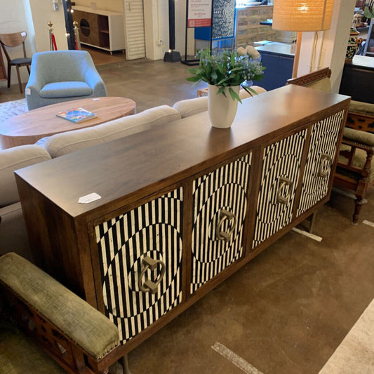Wooden sideboard with geometric design in a living room setting