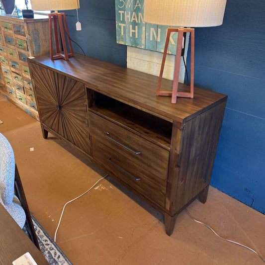 Wooden sideboard with lamps on a blue wall background