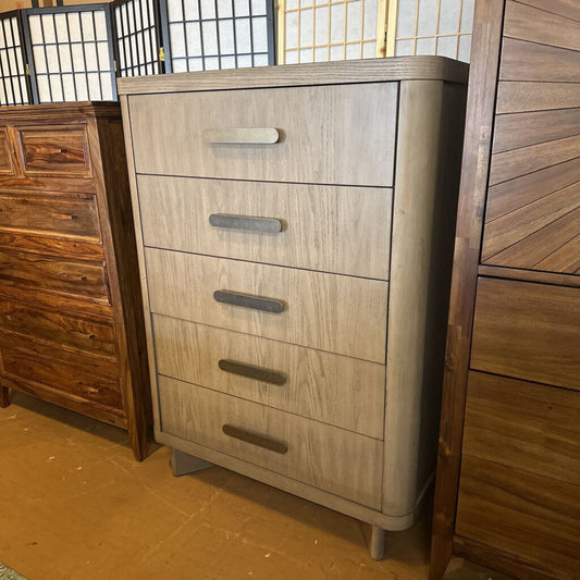 Wooden dresser with multiple drawers in a room setting