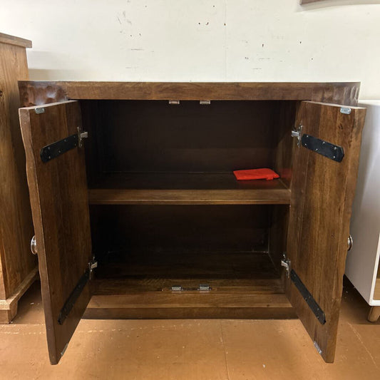 Wooden cabinet with open doors on a wooden floor.