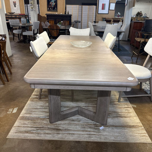 Dining table with chairs in a showroom setting