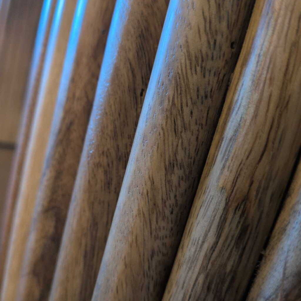 Close-up of wooden drumsticks with a focus on texture and grain.