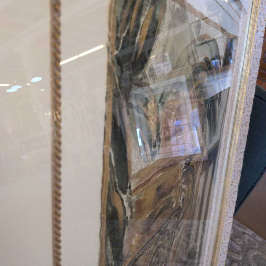 Decorative mirror with a reflective surface showing room interior.