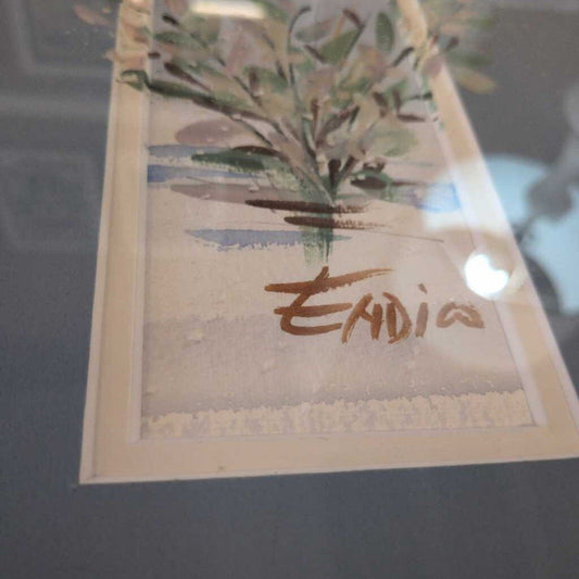 Card with a plant illustration and 'Endia' text on a reflective surface