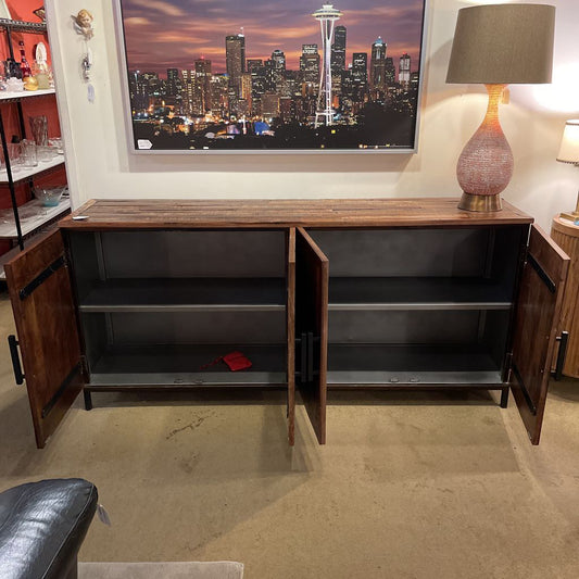 Wooden entertainment console with open doors, displaying a cityscape on a screen above.