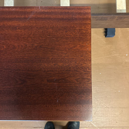 Dark wooden panel on a light wooden floor