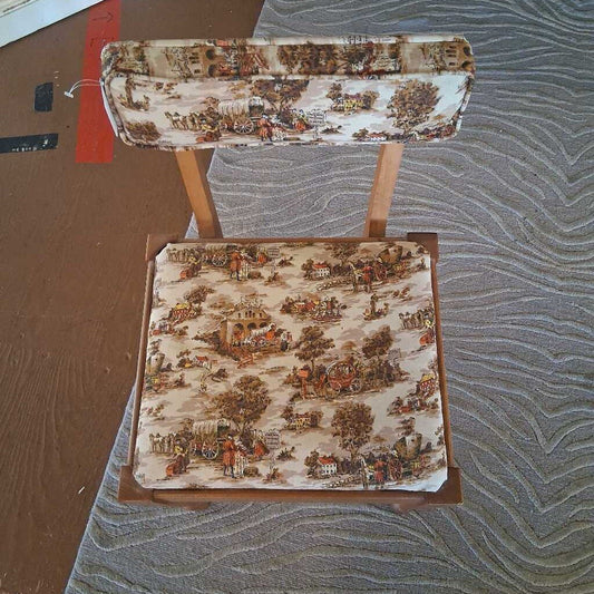 Chair with patterned seat and backrest on a textured surface