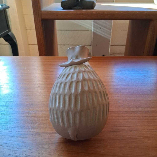 Decorative ceramic duck on a wooden surface