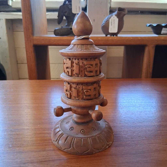 Wooden decorative item on a wooden table