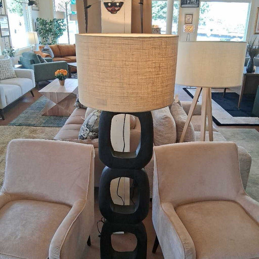 Decorative lamp with a unique black base in a living room setting