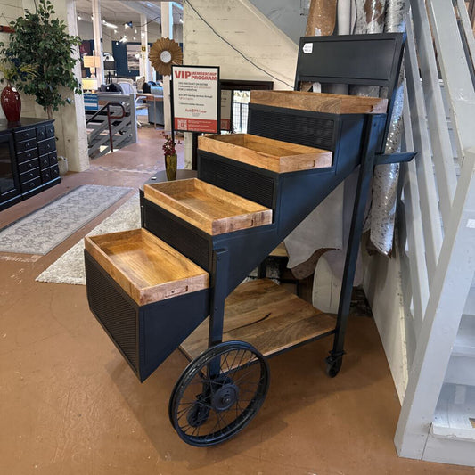 Wooden steps with metal frame and wheels in a store setting