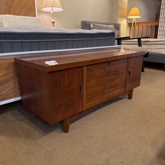 Wooden dresser with drawers in a room setting