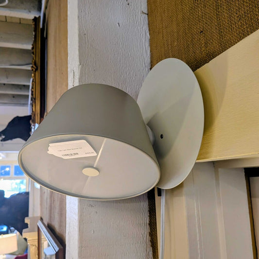 Gray wall-mounted lamp with a price tag attached, set against a neutral background.