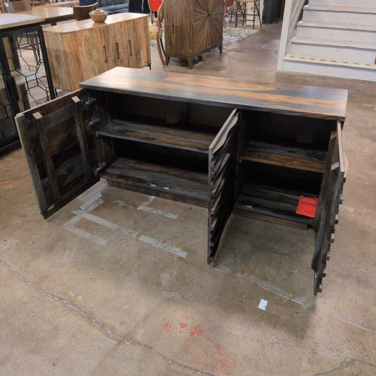 Wooden cabinet with open doors on a concrete floor