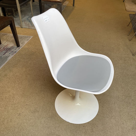 White chair with a gray seat on a beige carpeted floor