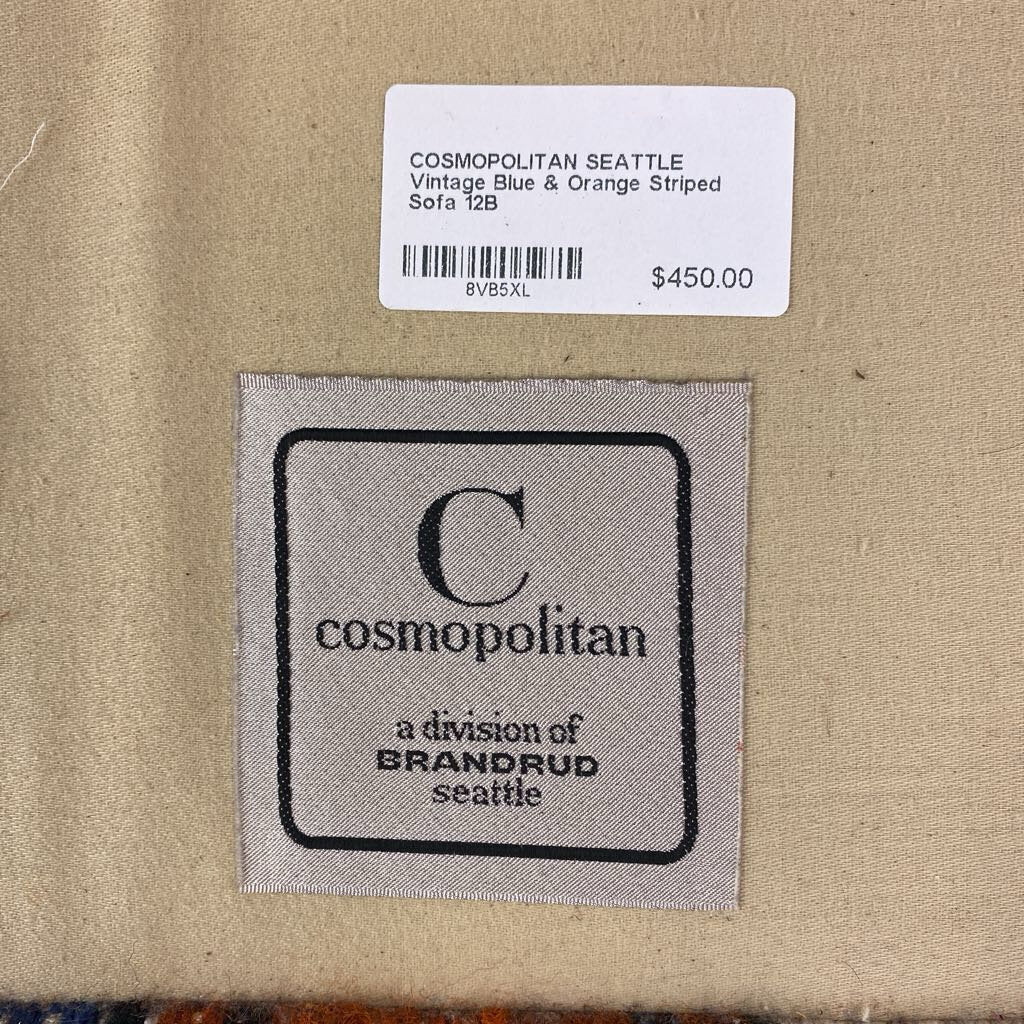 Cosmopolitan Seattle vintage blue and orange striped sofa with price tag and brand label.