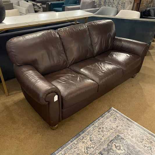 a dark brown leather 3 seat sofa with rolled arms and wooden legs