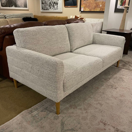 beige sofa with brown legs