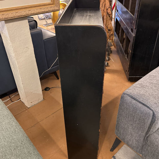 Black metal stand in a room with furniture and decor